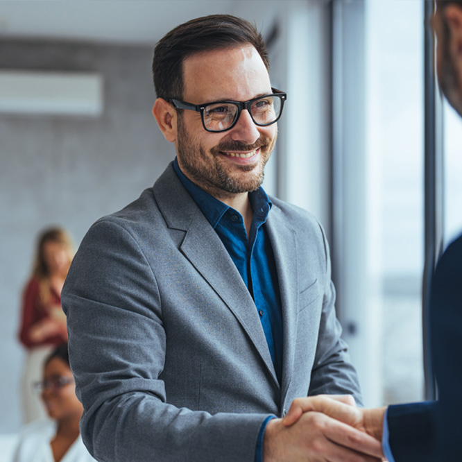 Businessman smiling shaking hand